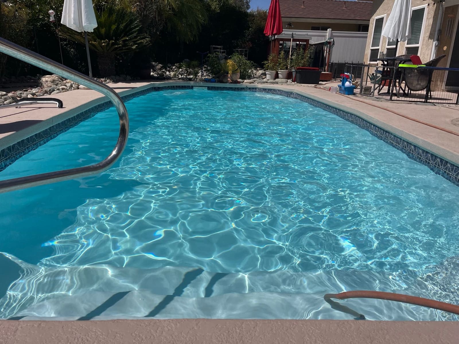 Bright blue swimming pool water after routine maintenance
